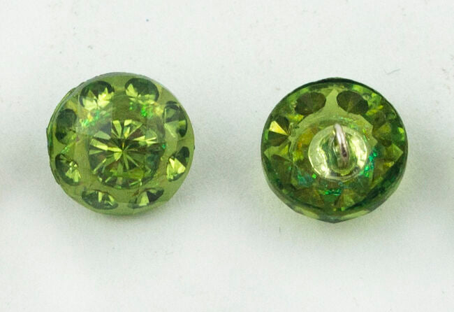 Close-up of a light green crystal button showing its unique design.