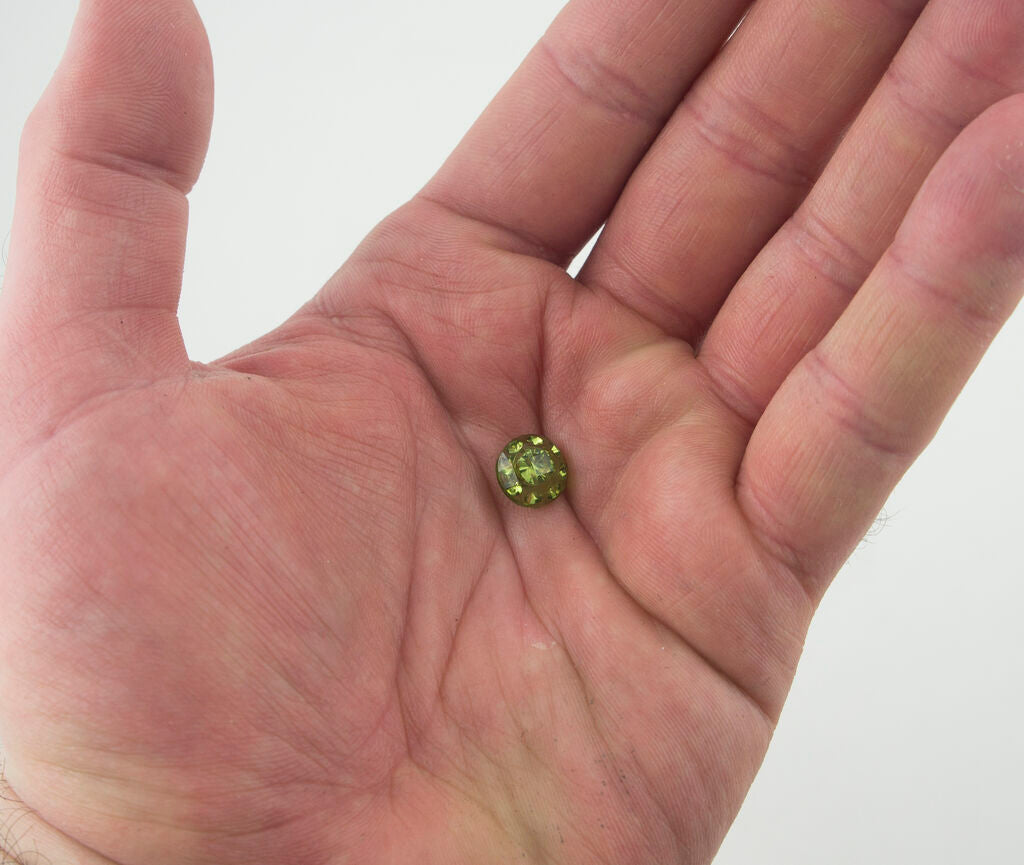 Light green crystal buttons arranged in a neat row.