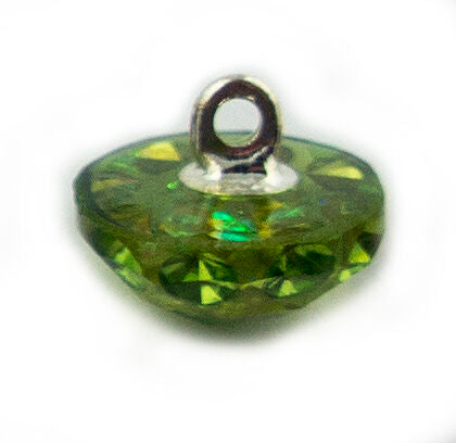 Light green crystal button on a knitted fabric swatch.