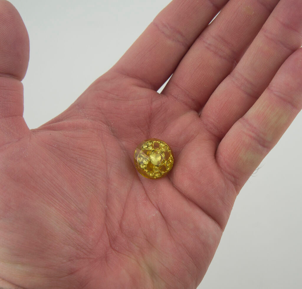 Comparison of green and yellow crystal buttons available
