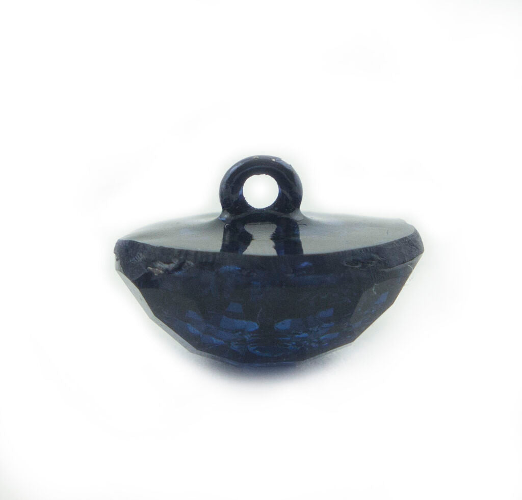 Midnight blue button in a sewing project context.