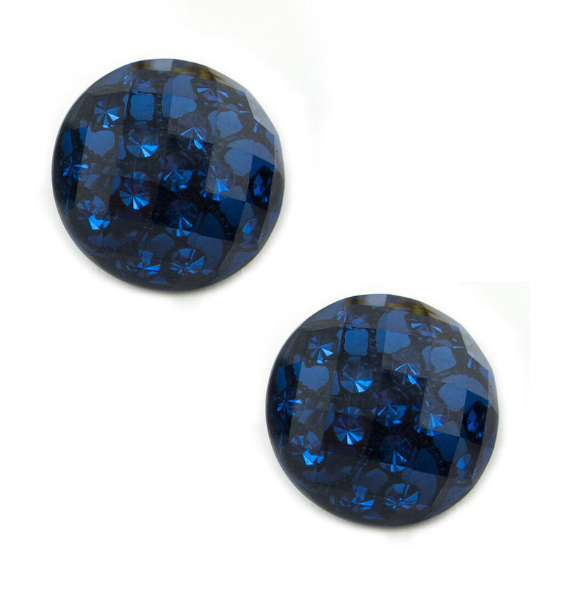 Two midnight blue crystal buttons on a white background.