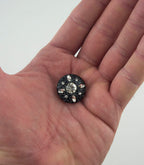 Pack of 5 black buttons with clear crystals