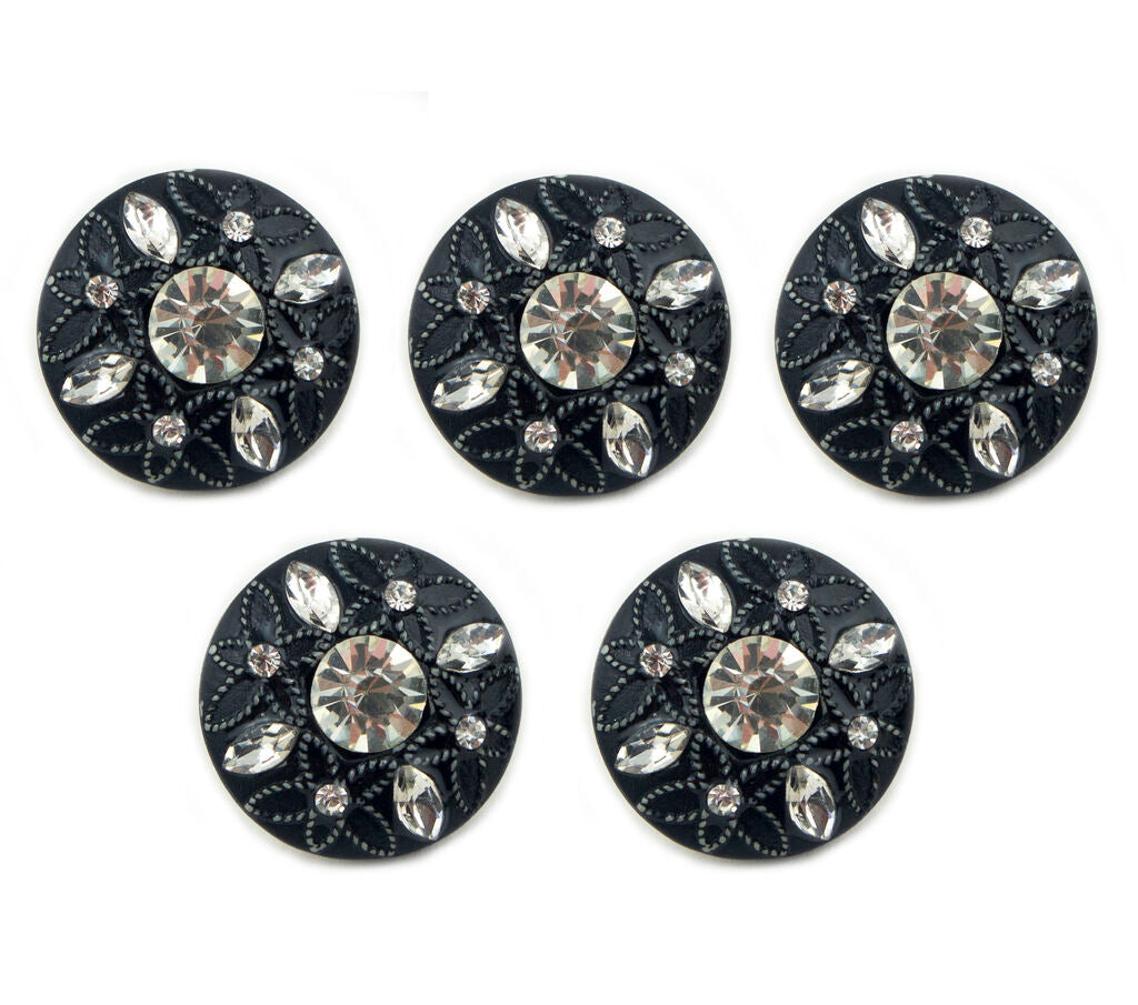 Close-up of embossed flower pattern on black button