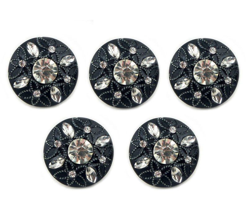 Close-up of embossed flower pattern on black button