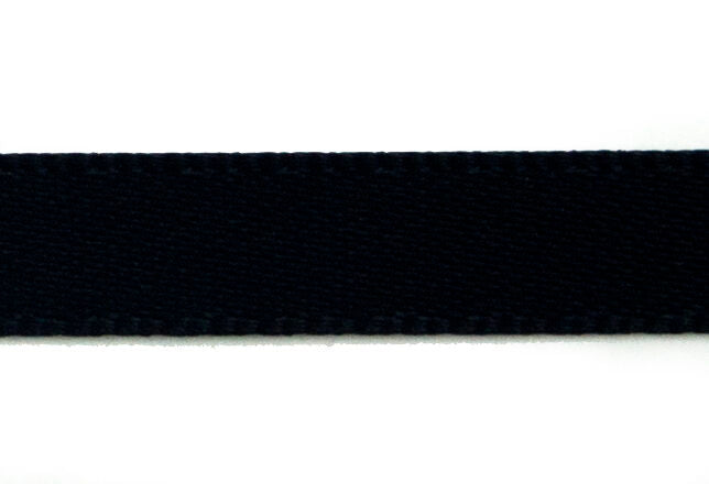 Black double faced satin ribbon on a crafting table