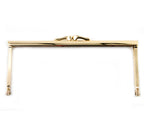 Elegant gold tone metal handbag frame with a square design.