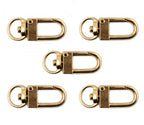 Five gold tone metal snap hook clasps displayed together.