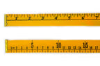 Close-up of a wooden ruler showing precise markings on both sides.