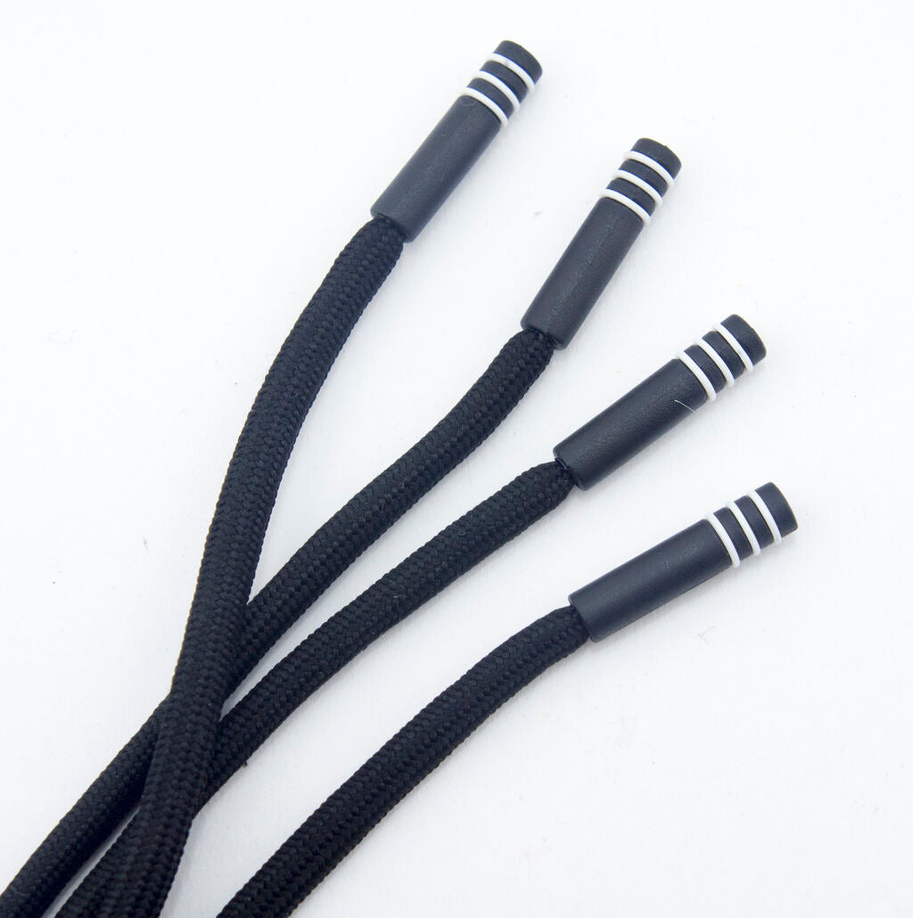 Black hoodie cords laid out flat to show length and diameter.
