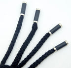 Close-up of the black hoodie cord ends featuring silver and black details.
