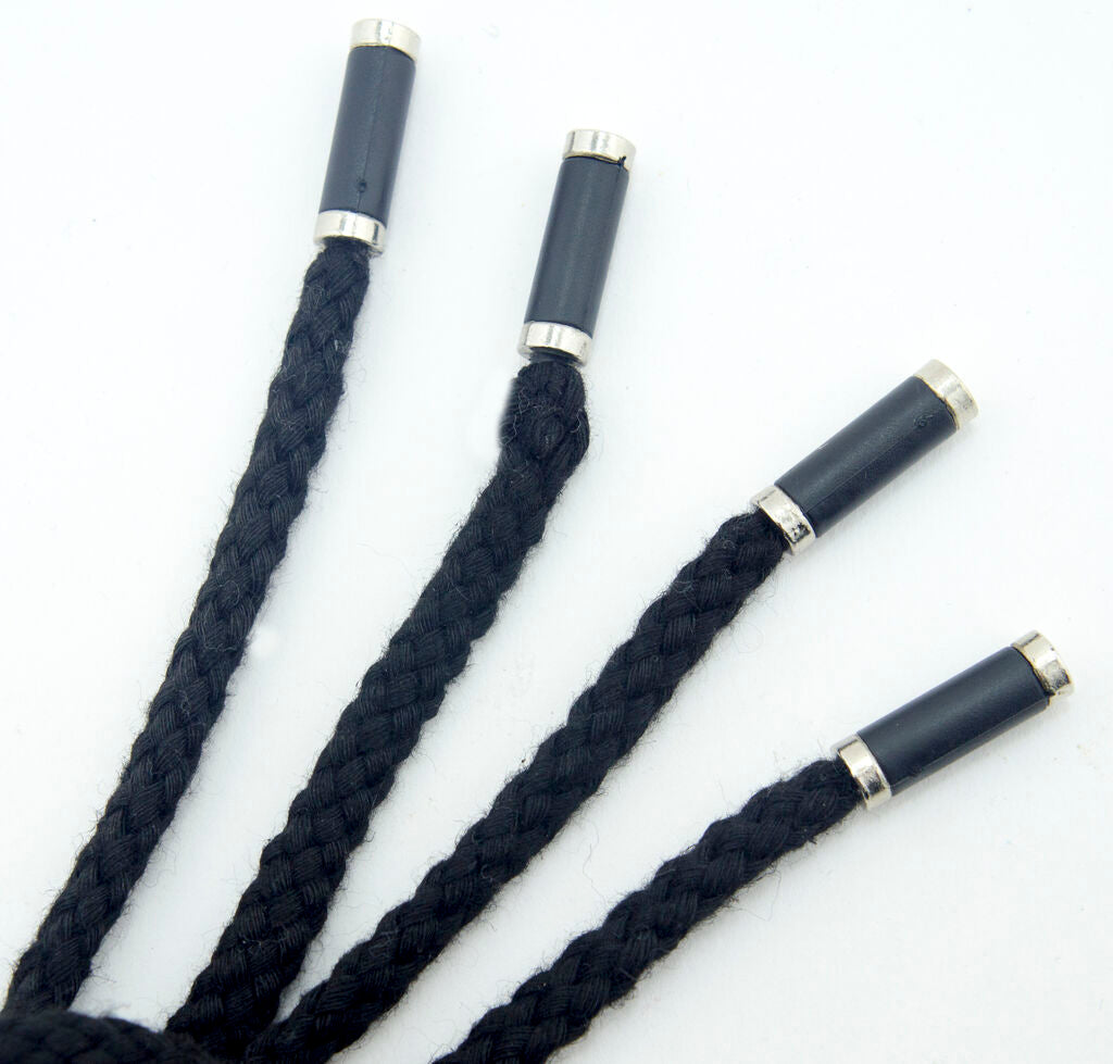 Close-up of the black hoodie cord ends featuring silver and black details.