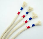 Close-up of cream rope hoodie cords showing tricolour end detail.