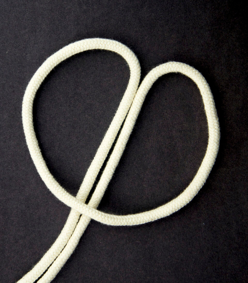 10 metres of densely woven cream cotton rope cord.