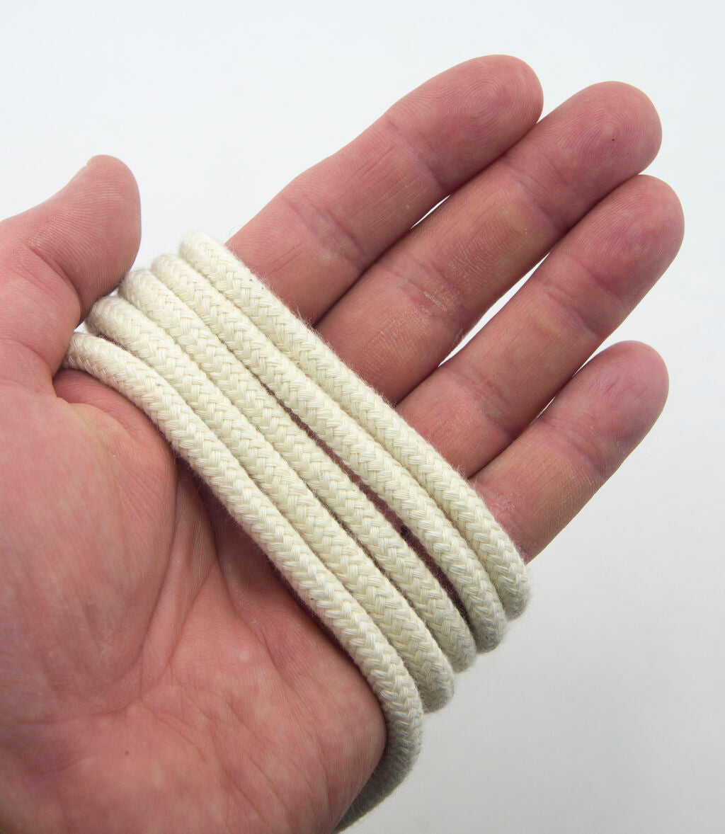 Close-up of 6mm cream cotton rope cord for crafting.
