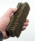Brush displayed on a clean surface, showcasing its size