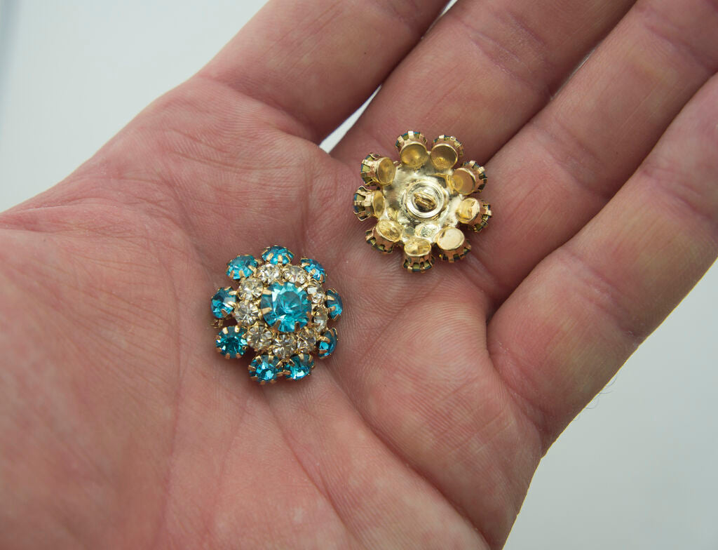Close-up of a marine blue crystal button, 20 mm diameter.
