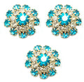 Set of 3 marine blue crystal buttons in a gold tone setting.