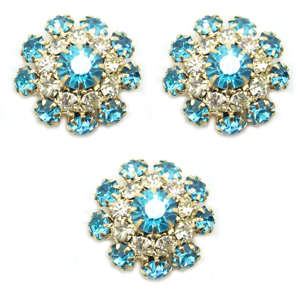 Set of 3 marine blue crystal buttons in a gold tone setting.