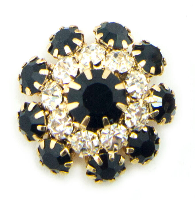 Crystal buttons displayed on a fabric background.