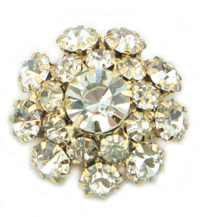 Clear crystal buttons displayed on a fabric background