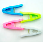 Close-up of a blue plastic clothes peg for laundry