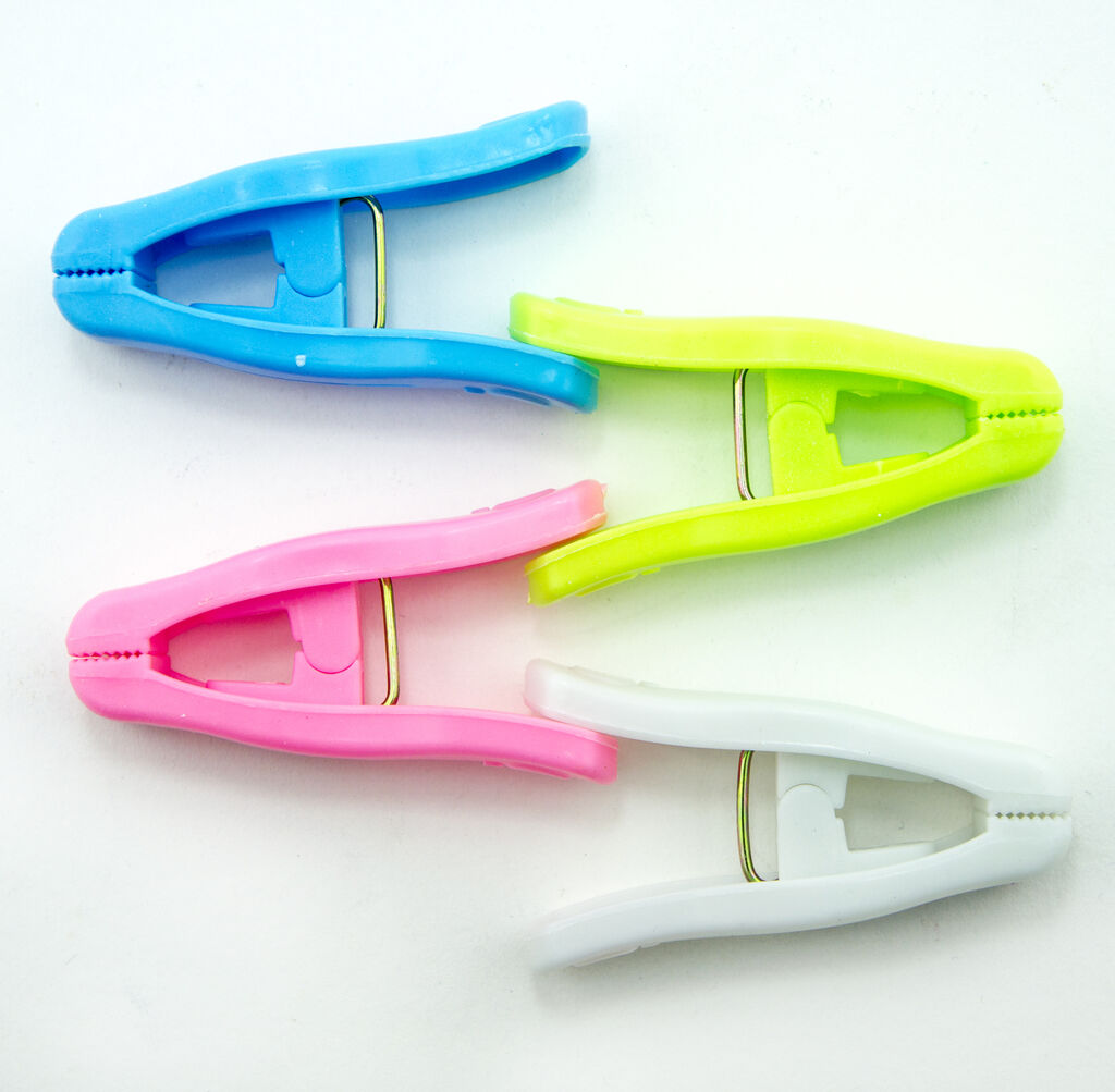 Close-up of a blue plastic clothes peg for laundry