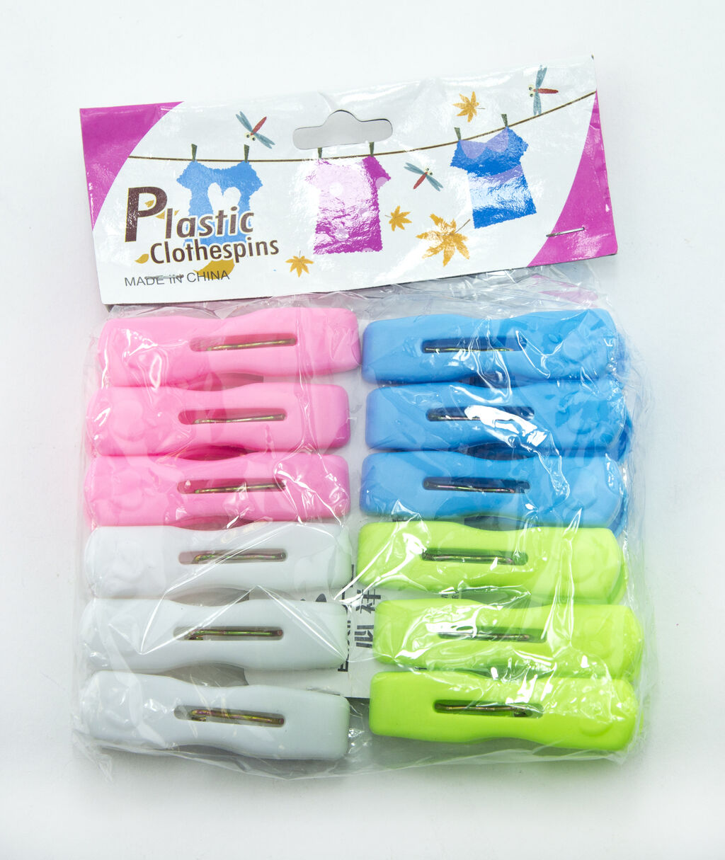 Display of pink and green plastic clothes pegs on a white background