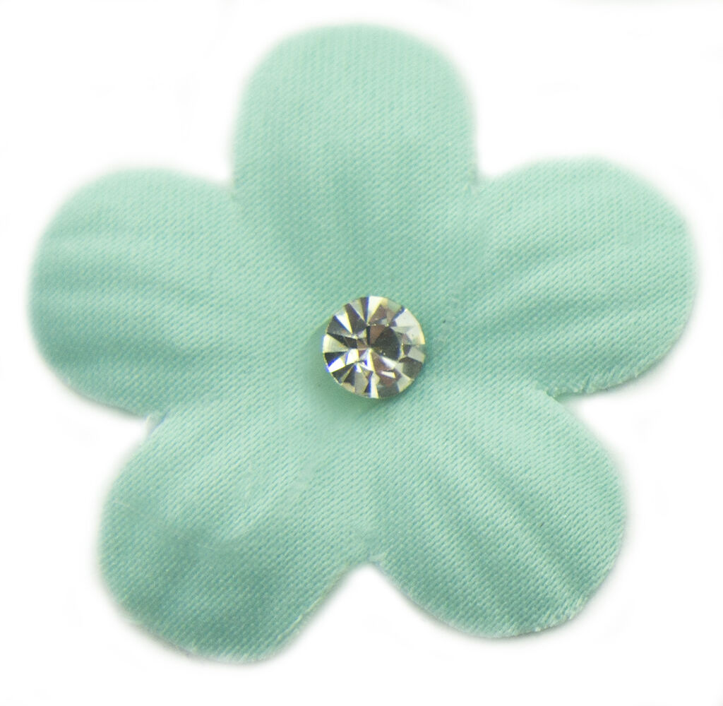Close-up of pastel blue flower trim showcasing crystal bead details.