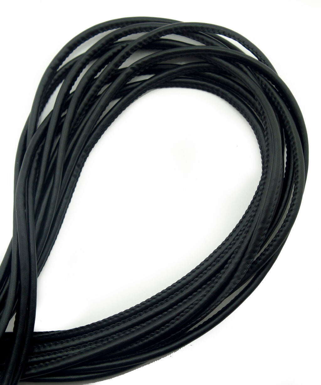 Matt round black leatherette PU trim piping on a white background.