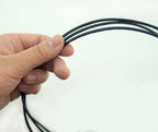 Close-up of 3mm wide black invisible seam trim for crafting.