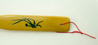 Back scratcher held in hand to demonstrate its length and use