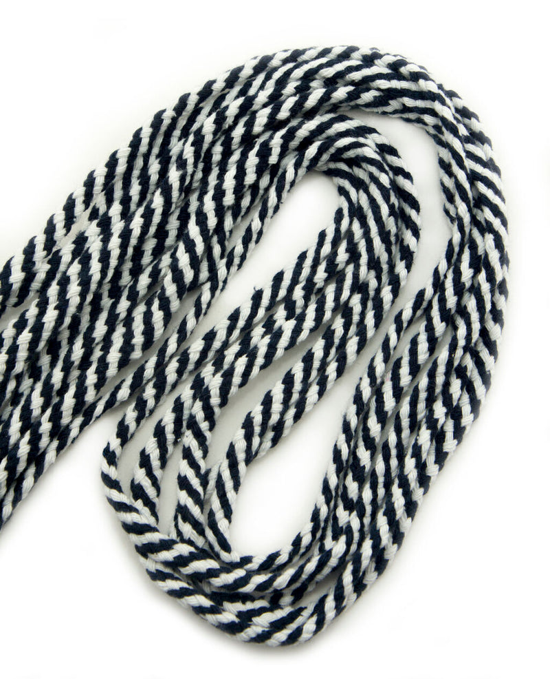 Black and white striped rope trim on a white background.