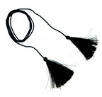 Four black silky polyester double end tassels on display