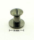 Various angles of the antique brass tone binding screws.