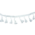 White cotton tassel trim displayed on a flat surface.