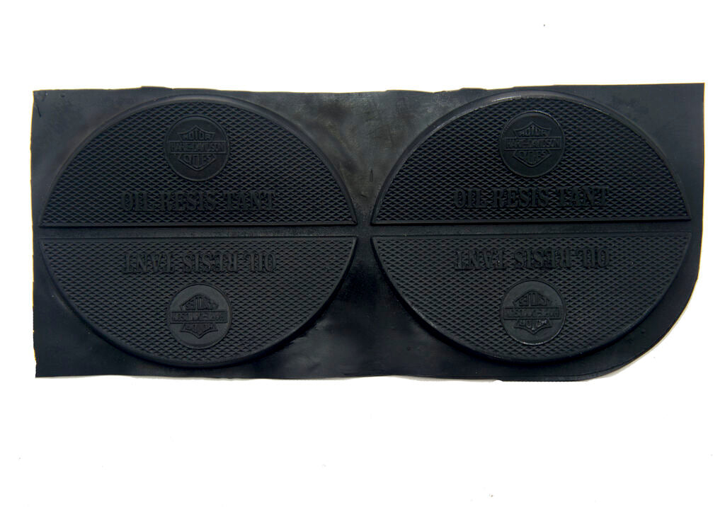 Two pairs of black rubber shoe and boot repair heel soles.