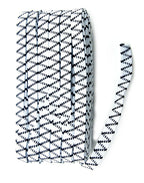 Roll of white and black sewing elastic on a table