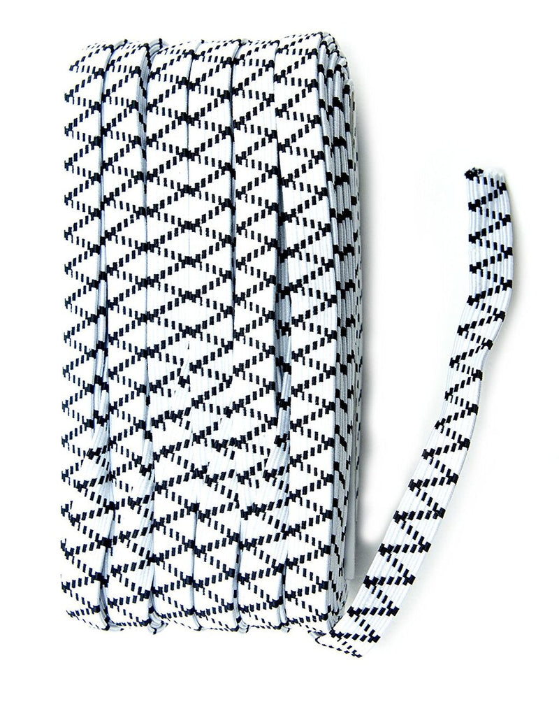 Roll of white and black sewing elastic on a table