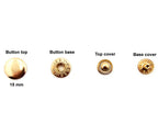 Different angles of silver tone 15 mm press stud buttons.