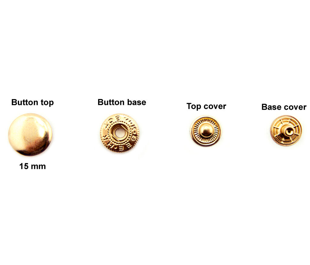 Different angles of silver tone 15 mm press stud buttons.