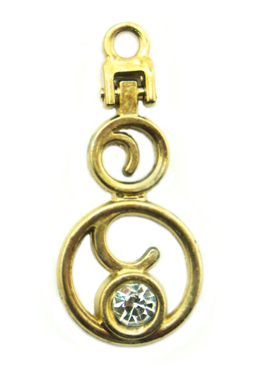 Close-up of elegant gold tone zip pull with white crystals.