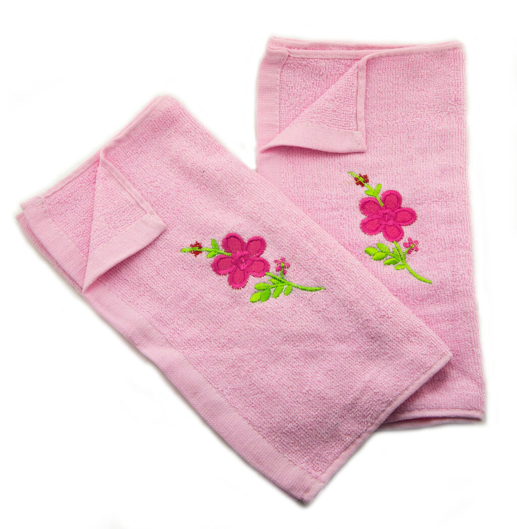 Pastel pink hand towel featuring an embroidered floral design.
