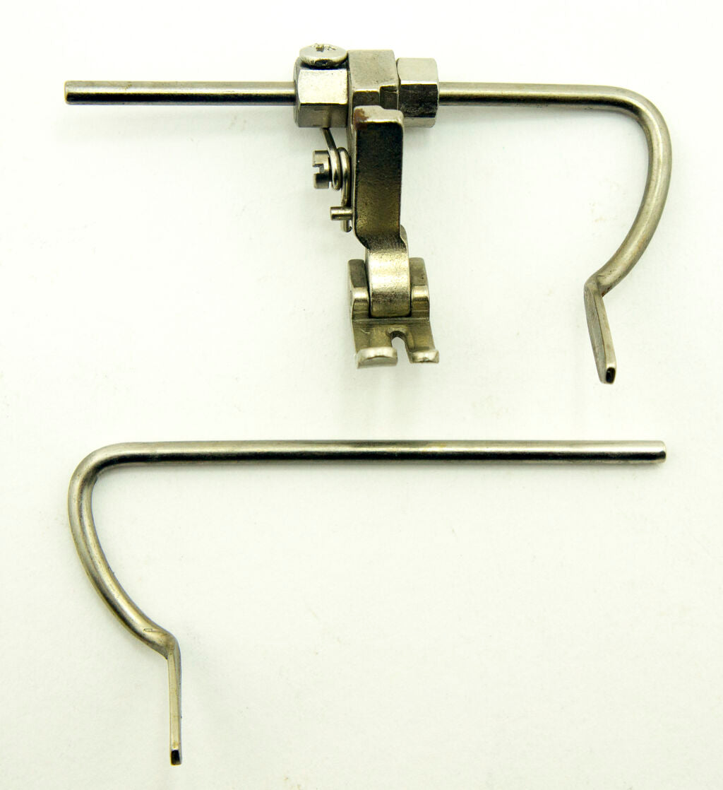 Close-up of the industrial sewing machine guide foot