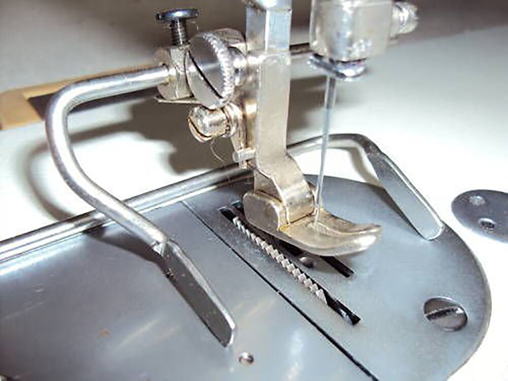 Guide foot installed on an industrial sewing machine