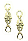 Two feminine flower embellishments in gold tone and white crystals.