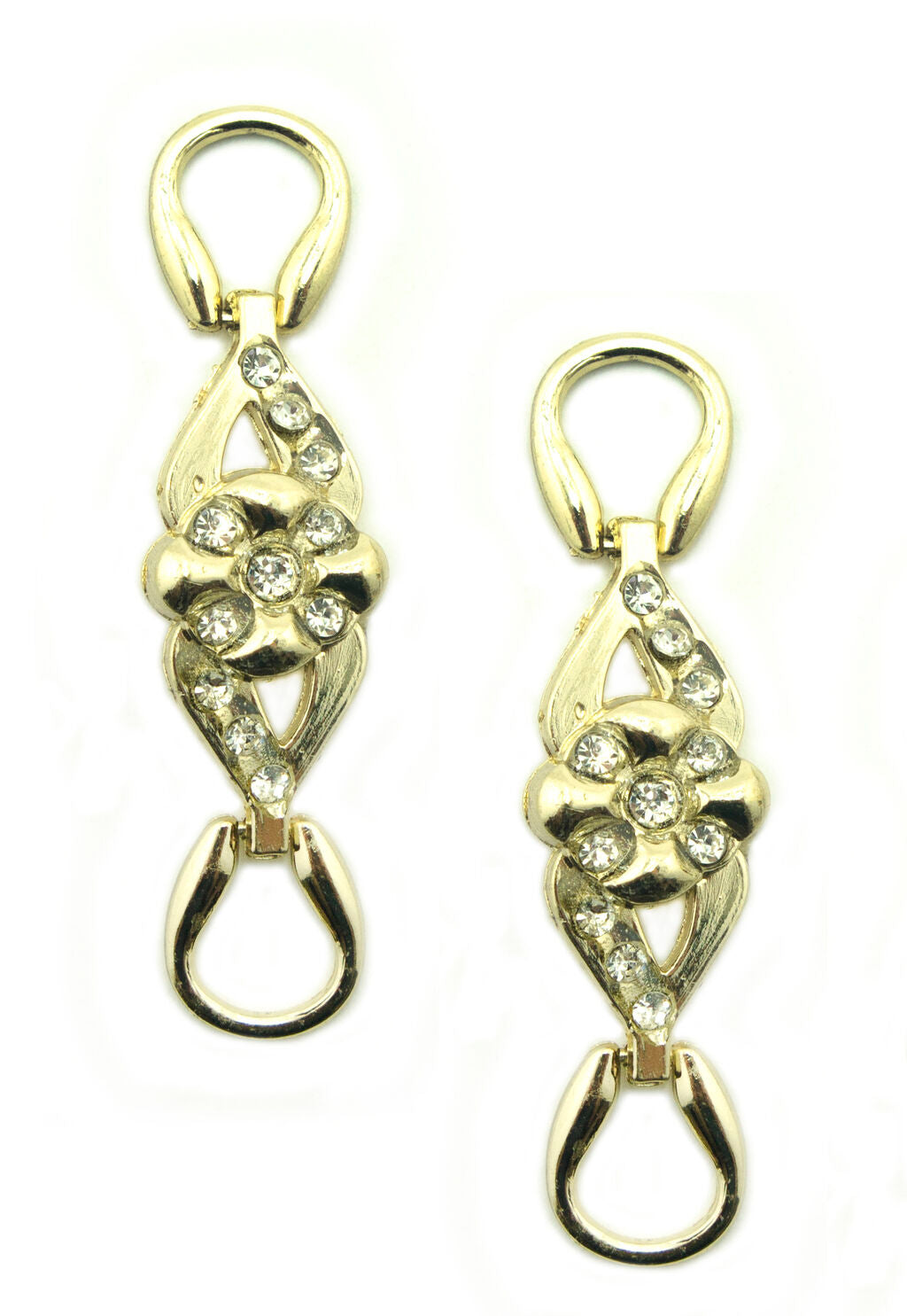 Two feminine flower embellishments in gold tone and white crystals.