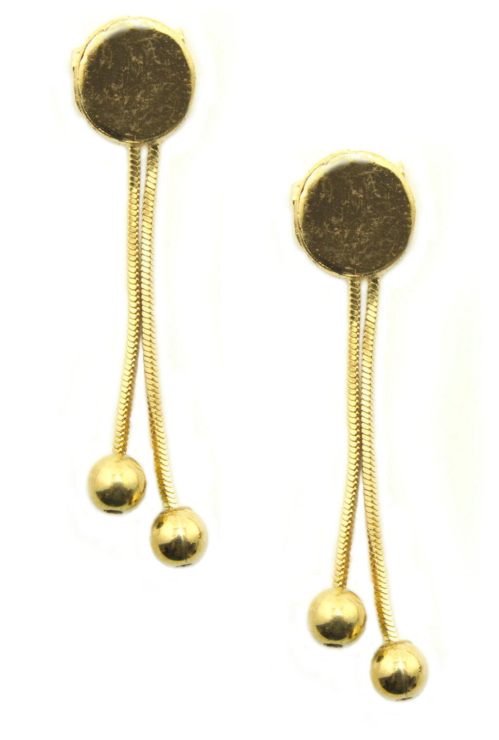 Close-up of gold tone plate with pretty gold drops.