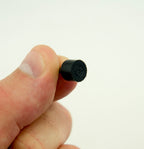 Close-up of black 9mm shoe heel tips for repair