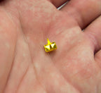 Pyramid studs displayed on a fabric background
